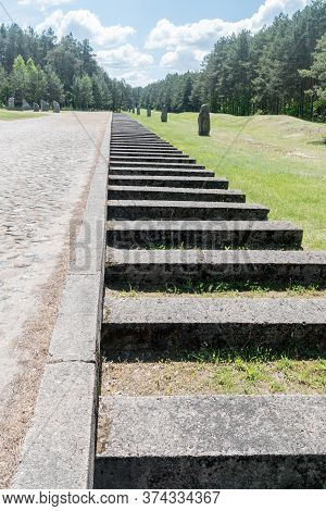 Wolka Okraglik, Poland - June 2, 2020: Concrete Blocks Marking The Path Of The Former Railway Spur A