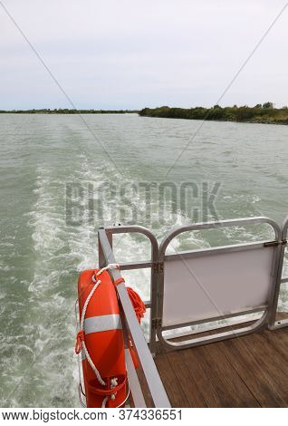 Wide Mouth Of Po River In Northern Italy And The Boat With Lifebelt