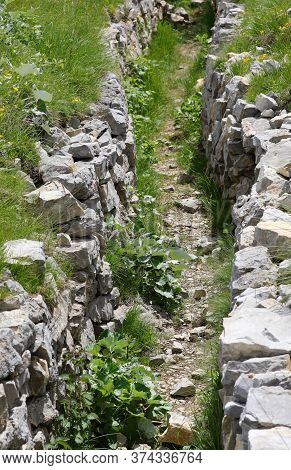 Trench Dug By Soldiers During The First World War In The Mountains Of The Veneto Region In Northern 