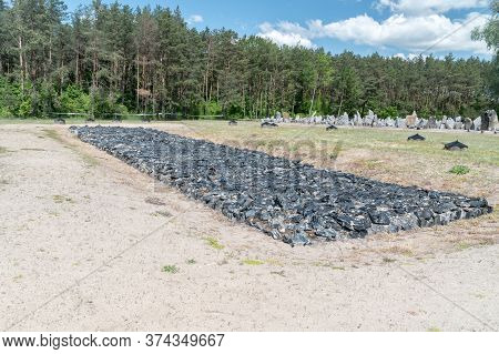 Wolka Okraglik, Poland - June 2, 2020: Stone Memorial Resembling One Of The Original Cremation Pits 