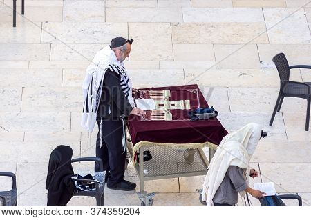 Jerusalem, Israel - 15.04.2015. Orthodox Jewish Men Pray At Western Wall In The Morning