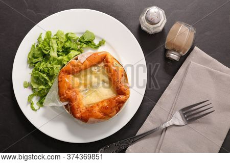 baked camembert, morbier with lettuce- top view