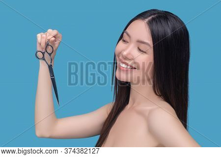 Smiling Woman Admitting No Need In Cutting Split-ends