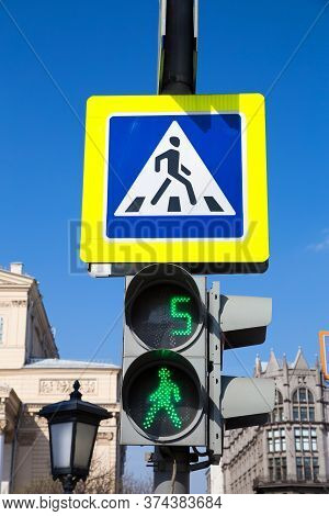 Moscow, Russia - April 26, 2020: Traffic Lights On The Street. The Light Is Green. Pedestrians Are A