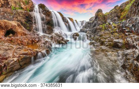 Breathtaking View Of  Kolufossar Waterfall At Sunset.  Popular Tourist Travel Destination In Iceland