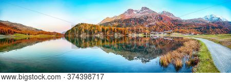 Stunning Autumn Panorama Of Silvaplana Lake And Surlej Village.  Mirror Reflaction In Lake. Location