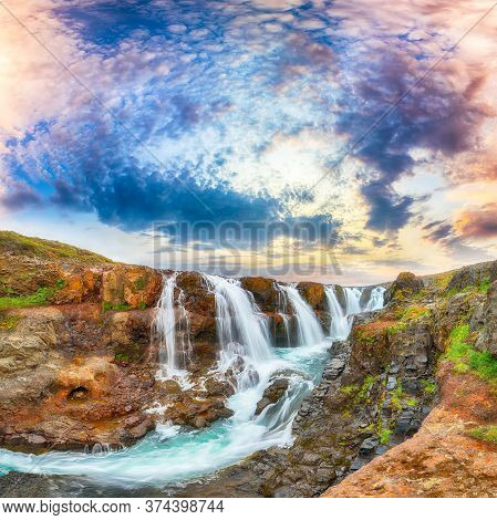 Breathtaking View Of  Kolufossar Waterfall At Sunset.  Popular Tourist Travel Destination In Iceland