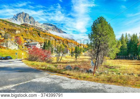 Awesome Autumn Scene Near Maloja Village Overlooking Mount Piz Materdell  . Colorful Autumn Scene Of
