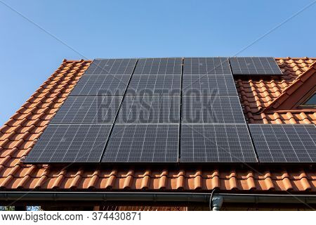 Solar Electric Panels On A House Roof In  Ochojno. Poland