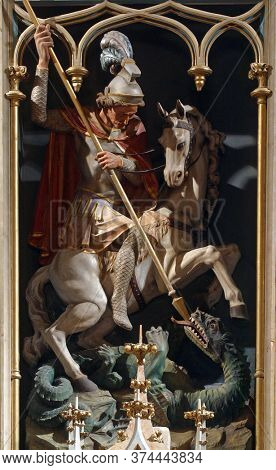 DESINIC, CROATIA - OCTOBER 18, 2013: Saint George slaying dragon, statue on a high altar in the parish church of Saint George in Desinic, Croatia