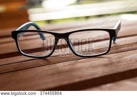 Dirty Eyeglasses, Presciption Glasses, On Display, With Several Spots, Marks And Fingerprints Traces
