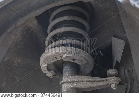 old dirty tie rod end and shock absorber