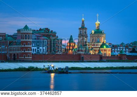 Orthodox Christian Church On The Embankment Of River At Sunset. Kokshaga River, Yoshkar-ola Ciy, Mar