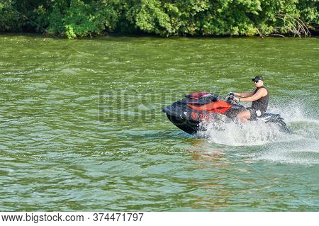 Voronezh, Russia - 23.08.2019 - Man On Water Scooter. Summer Vacation On Personal Watercraft In Trop