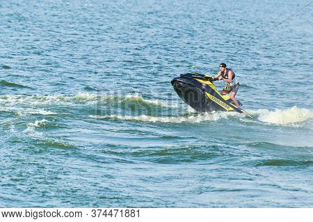 Voronezh, Russia - 23.08.2019 - Man On Water Scooter. Splashes And Drops Around. Summer Vacation On 