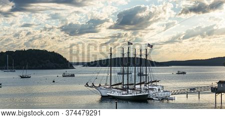 A Peir With Sailboats Used To Take Tourists Around The Bay In Bar Harbor Maine Under Cloudy Early Mo