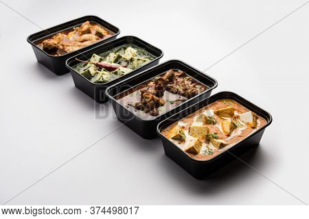 Online Food Delivery Concept For Indian Restaurant Showing Plastic Containers With Food
