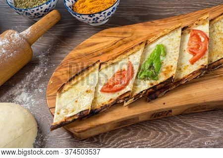 Traditional Turkish Baked Dish Pide. Turkish Pizza Pide, Middle Eastern Appetizers. Turkish Cuisine.