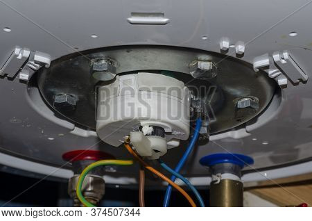 Detailed Shot Of The Bottom Of The Water Heater. Leaking Outboard Home Boiler. Repair And Maintenanc
