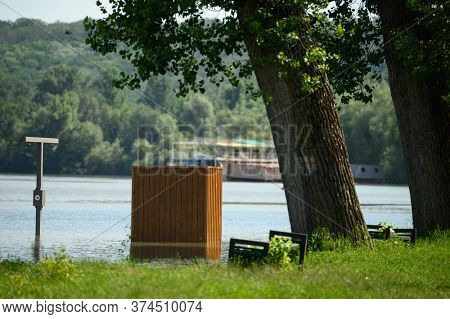 Vadul lui Voda, Criuleni, Moldova, June 2020: Flood caused by Dniester river spill after heavy rains set in Vadul lui Voda beach area. Flooded beach cabin, shower and bench