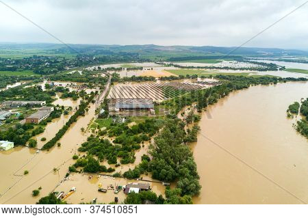 Aerial View Of Dnister River With Dirty Water And  Flooded Houses In Halych Town, Western Ukraine.