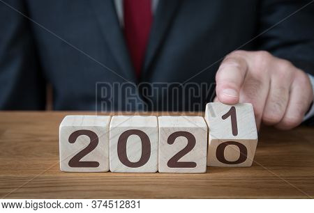 A Close Up Of A Businessman Looking Ahead To The Future With Confidence And Changing The Date Of A C