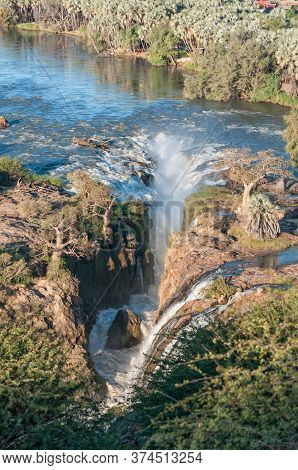 Part Of The Epupa Waterfalls In The Kunene River. Baobab And Makalani Palm Trees Are Visible