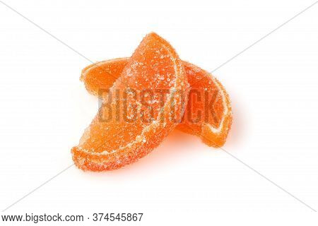 Composition Of Marmalade Candy In Shape Of Citrus Fruits Wedges. Yellow And Orange Jelly Sweet Candi