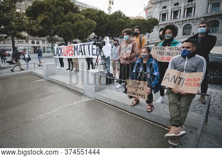 Porto, Portugal - June 6, 2020: Group Of Portugues People With Anti-racists Posters And Placards Dur