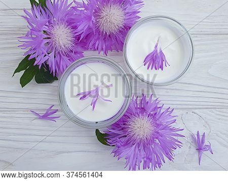 Cream Cosmetic Flower On Wooden Background\n Decoration