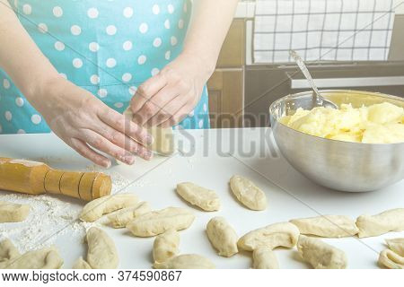 Cooking Vegetarian Dumplings With Mashed Potatoes (kreplach, Jewish Ravioli) In Home Kitchen. Female