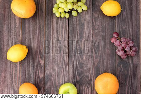Fruits On A Wooden Table. Located Around The Edge In A Circle
