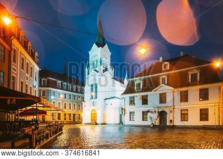 Riga, Latvia - July 3, 2016: White Tower With Pyramidal Spire Of Our Lady Of Sorrows Or Virgin Of An