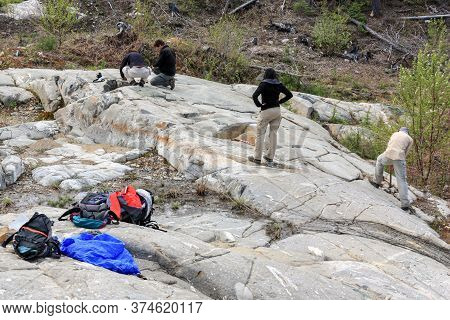 Sudbury, Ontario, Canada - May 23 2009: Group Of Workers And Geologists Standing And Working On Geol