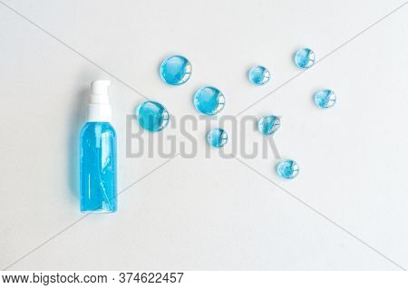 Blue Gel Spray, Drops, Glass, On A White Background, Top View.