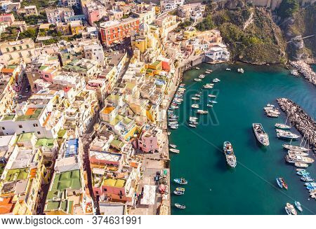 Aerial Drone View Of Vibrantly Colorful Houses Of Marina Corricella In Sunny Summer Weather At Proci