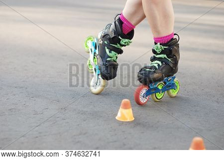 Roller Skater Legs In Motion, Inline Roller Skating, Rollerblading, Slalom On Asphalt Surface. Small