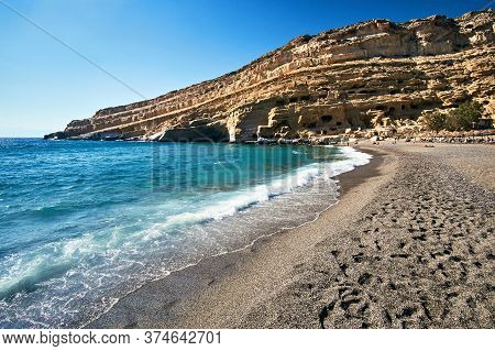People On The Sandy Matala Beach On The Island Of Crete In Greece