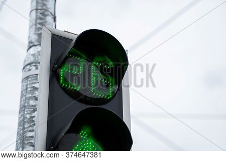 Green Trafic Light In The City In A Daylight.