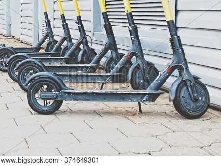 Group Of Sharing E-scooters, Eco Friendly And Trendy Mobility Concept Of Sharing Electric Scooter.