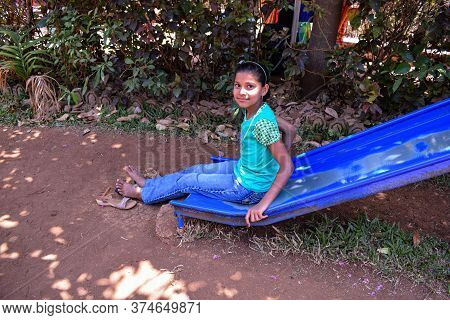 Kolhapur , Maharashtra / India- May 15th 2019; Indian Girl Playing On Slider In A Park