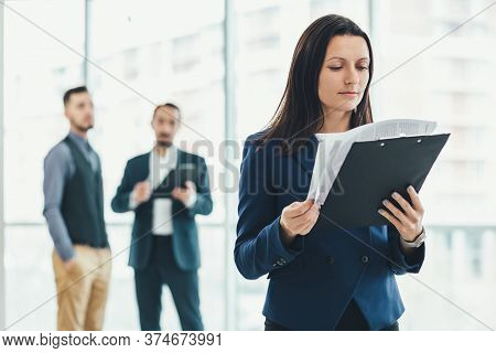 Business People Analysing Risks For Their Business In Office Environment.
