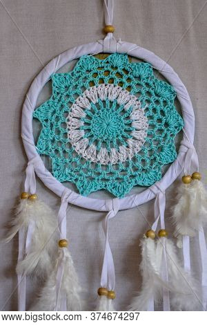 Dream Catcher With Blue Turquoise Threads Closeup In The Interio