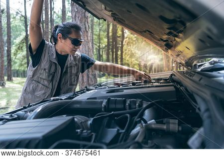 Asian Man Opening The Bonnet Of His Pickup Truck To Check The Condition Of The Engine Failure, To Be