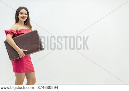 Young Old-fashioned Female In Summer Outfit Sitting Holding A Retro Suitcase Ready For Increadible V
