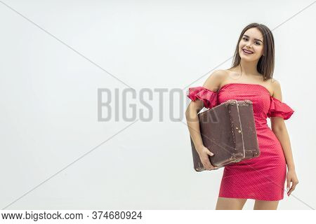 Young Old-fashioned Female In Summer Outfit Holding A Retro Suitcase Ready For Increadible Vacations