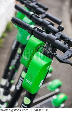 Bucarest, Romania - May 26. 20202: Image Of Some Lime-s E-scooters Parked On Sidewalk In Bucharest, 