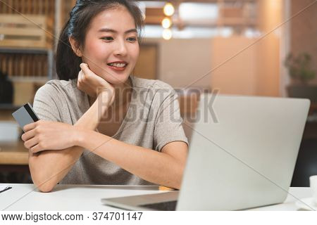 Close Up Hand Of Person Shopping In Mobile And Paying Via Internet Bank.