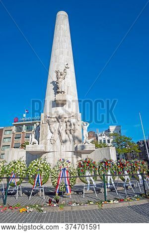 Amsterdam, Netherlands - May 5, 2020: Wreaths at the National Monument on the occasion of remembrance of the worldwar II in Amsterdam the Netherlands