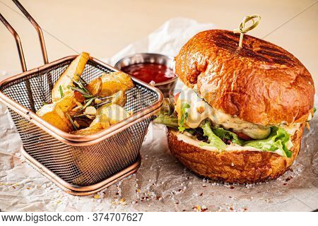 burger with tomato sauce and baked potato